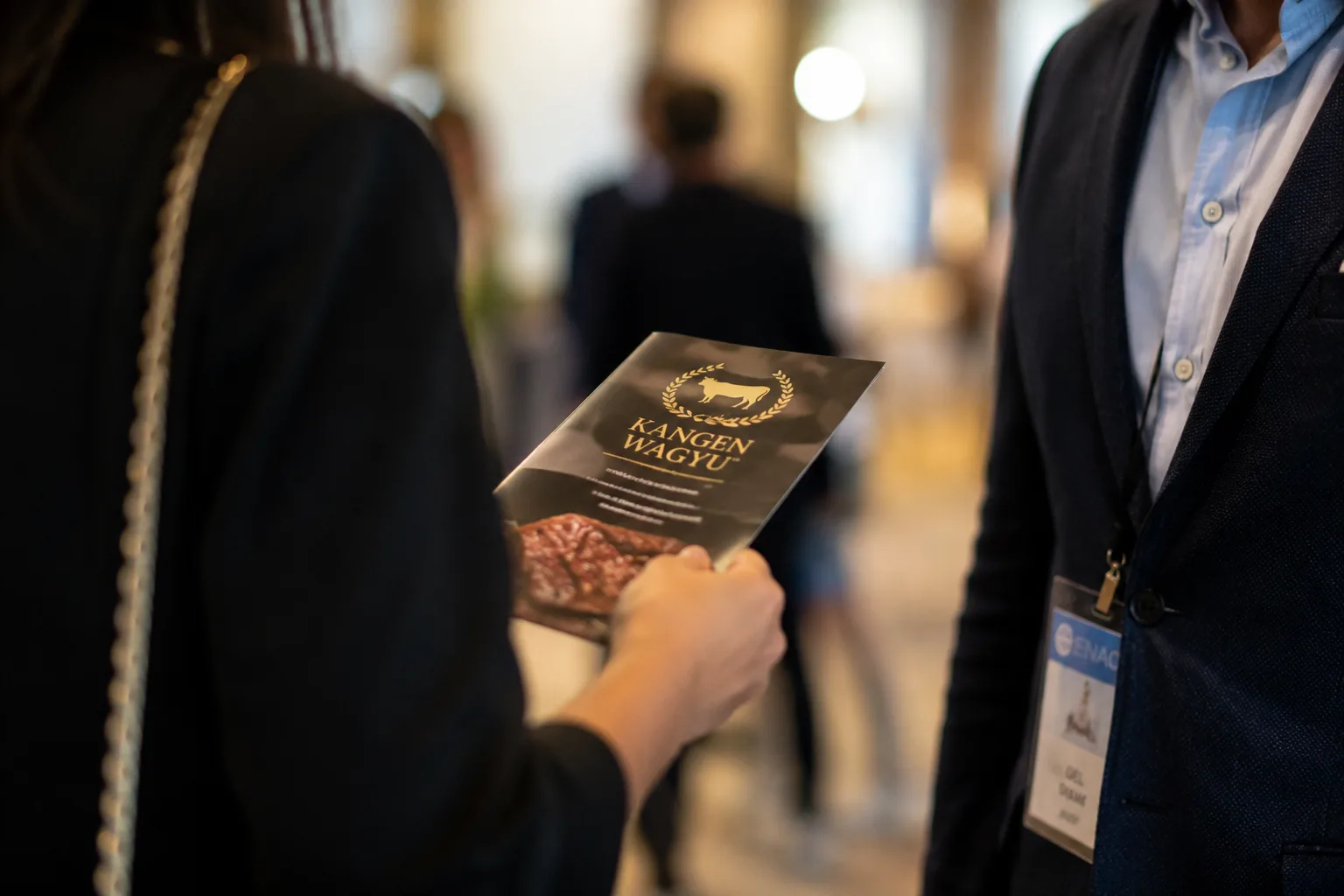 A Kangen Wagyu brochure being handed over at an Enagic event